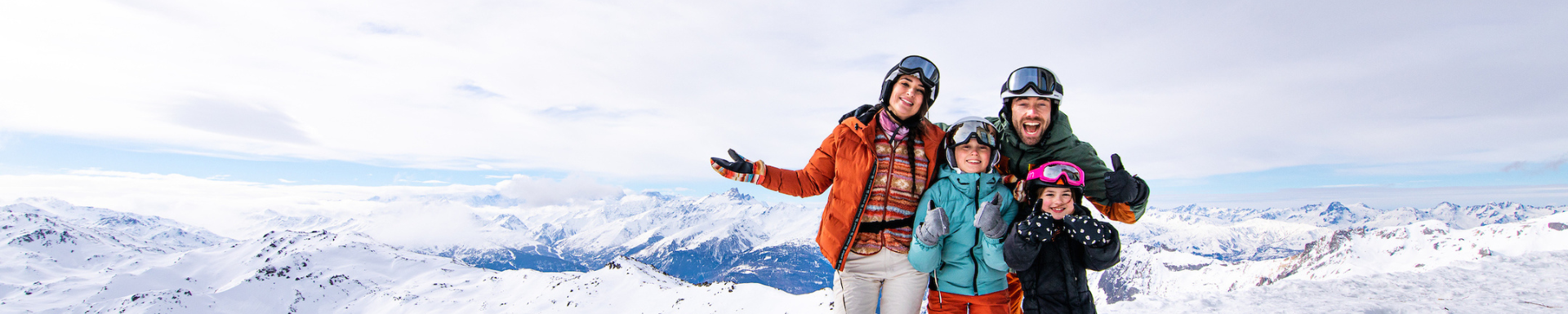 Happy family on a ski holiday to France staying at Madame Vacances