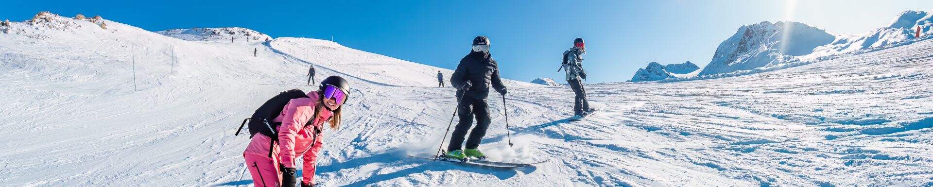 Colourful group of friends having a Easter ski holiday in Les Sybelles with Sunweb